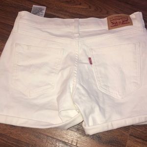 White Levi shorts.